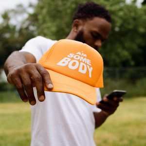 <p style="color:rgb(255 165 0);"> “The Orange Hat”</p>